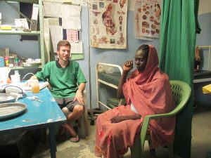 Johannes Plate with a patient at Lewere Hospital (Nuba Reports)